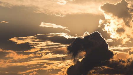 sunset orange sky with clouds for backgroundの写真素材