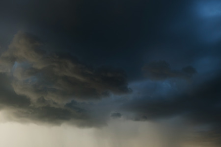 heavy rain storm clouds, thunderstorm dramatic sky, bad day weather backgroundの写真素材