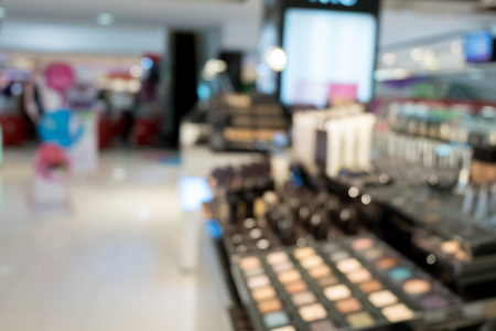 sets of makeup in department store shopping mall, image blur defocused background