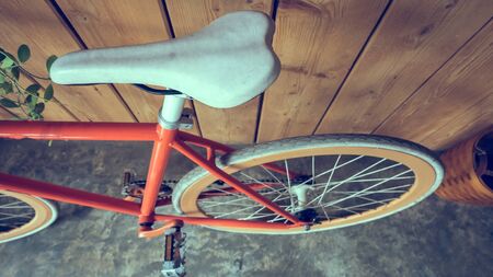 fixed gear bicycle parked with wood wall, close up image part of bicycleの写真素材