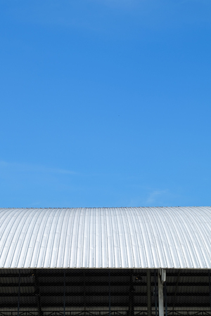 roof of metal sheet building with clear blue sky backgroundの写真素材