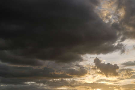 black cloud on sunset dramatic dark sky background