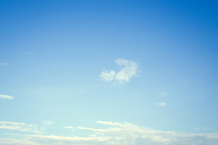 clear blue sky with white cloud backgroundの写真素材