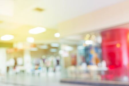 image blur background, luxury shopping mall department store with people walking shoppedの写真素材