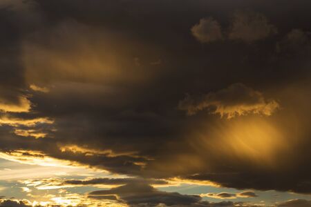 golden sunset sky and glowing cloud, twilight sky before rain storm weather background