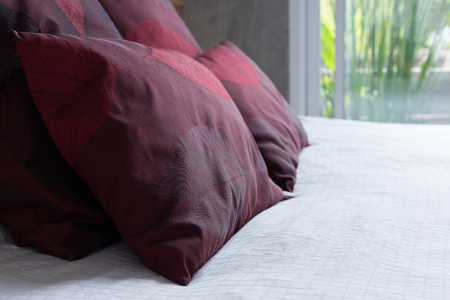 bedroom interior design modern style with white mattress and red pillowの写真素材