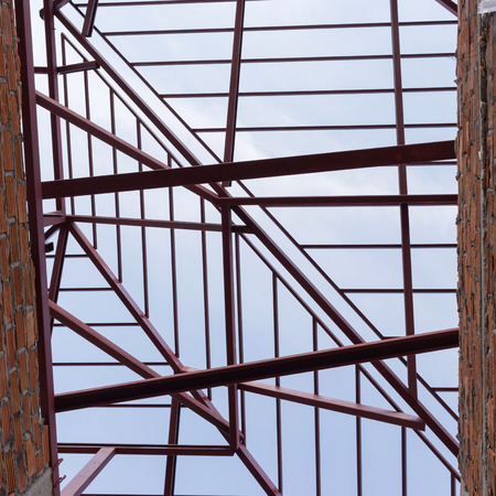structural steel beam on roof of building residential constructionの写真素材