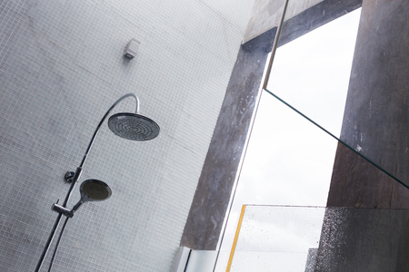 shower head in bathroom, design of home interior outdoor bathroom with open roofの写真素材