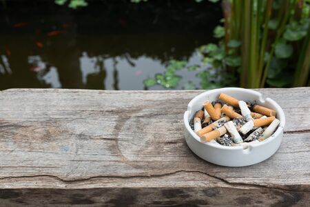 cigarette stub in ashtray, image no smoking concept background