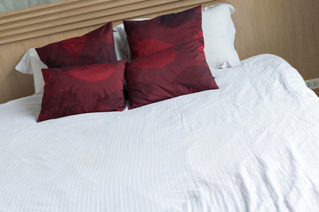 bedroom interior design modern style with white mattress and red pillow
