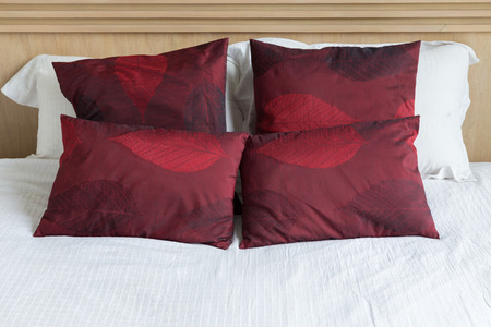 bedroom interior design modern style with white mattress and red pillow and wooden headboard
