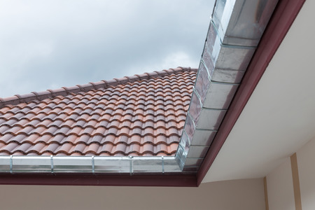 gutter roof residential building house in rainy dayの写真素材