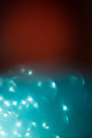 abstract green blur bokeh light celebration backgroundの写真素材