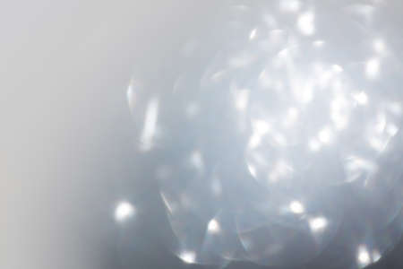 abstract white bokeh light celebration blur backgroundの写真素材