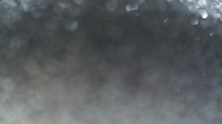 abstract white bokeh light celebration blur backgroundの写真素材
