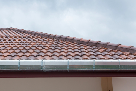 gutter roof residential building house in rainy day