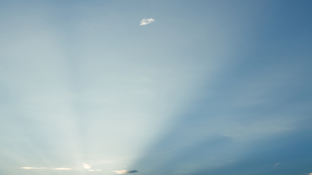 light rays on clear blue sky background