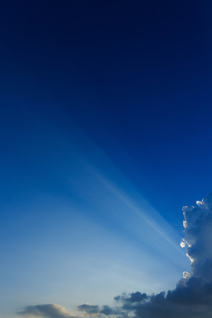 light rays on clear blue sky backgroundの写真素材