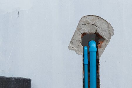 water pipe pvc plumbing under cement wall in construction site building