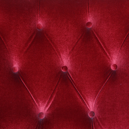 red fabric cushion furniture sofa texture backgroundの写真素材