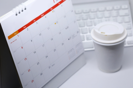 desktop calendar blank schedule of 1 january 2017 put on table work office with coffee cupの写真素材