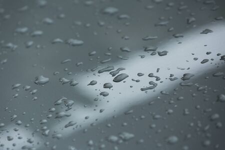 rain drops on car with glass coating protection skinの写真素材