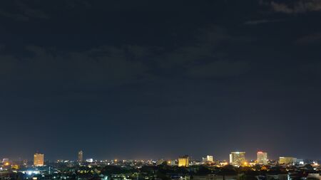 beautiful landscape city night with dramatic moody dark sky, point of view nightlife cityscape with town lightの写真素材
