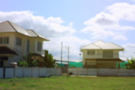 residential house village suburb with grass field playground, image blur backgroundの写真素材