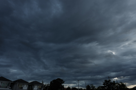 dramatic moody dark storm cloud sky used image for a bad day backgroundの写真素材