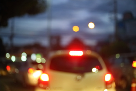 traffic light of driving car on city night street road, abstract blur bokeh background