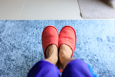 house slipper shoe in living room with blue carpet softnessの写真素材