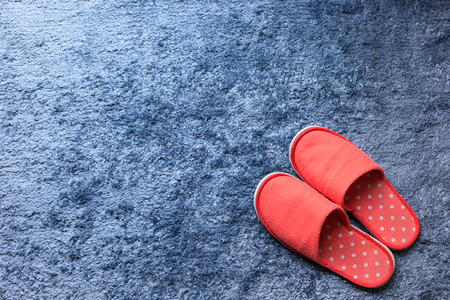 red slipper shoe on blue carpet mat softness texture decorated floor interior house