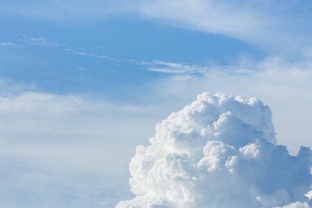 fluffy cloud above clear blue sky cloudy background