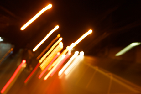 traffic light of driving car on city night street road, abstract blur bokeh backgroundの写真素材