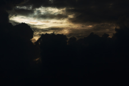 heaven light in dramatic sky with dark cloudの写真素材