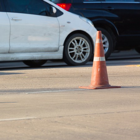 construction cone on urban roadの写真素材