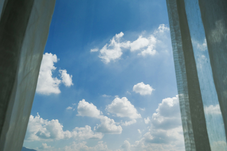 clear blue sky with cloud natural view outside the windowの写真素材