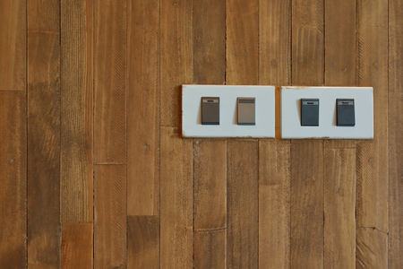 button switch on and off light on wooden wallの写真素材