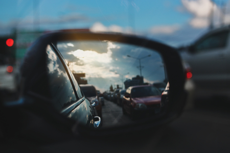 vehicle car travel road trips at town with twilight sky view on sideview of mirror