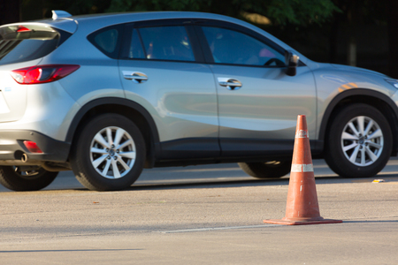 construction cone on urban roadの写真素材