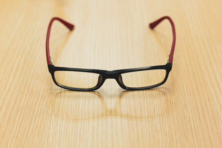 eyeglasses on wooden table office