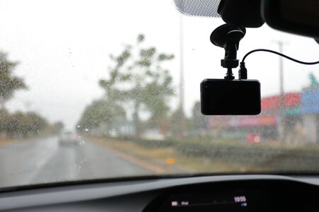 video camera recorder inside car driving rainy dayの写真素材