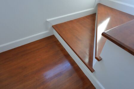 brown wooden hardwood stair in modern residential house