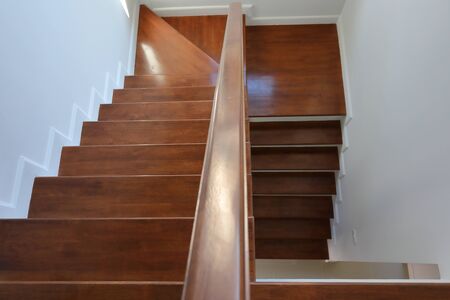 hardwood handrail banister on brown wooden stair interior decorated modern style of residential houseの写真素材