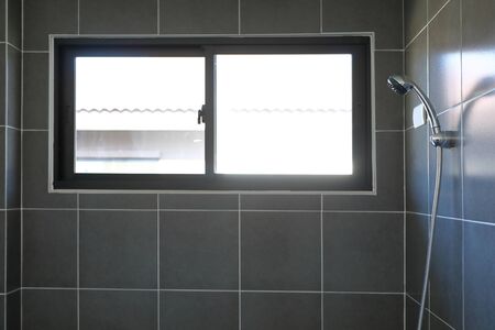 shower head in modern black bathroomの写真素材
