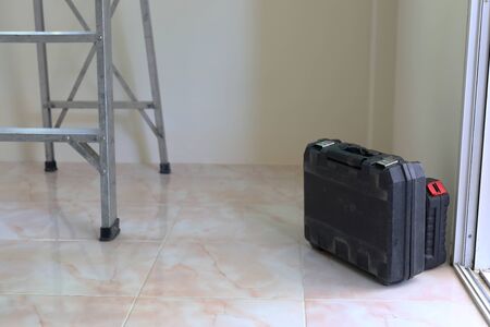 ladder stair and tool box of worker in construction house