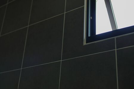 open small glass window in bathroomの写真素材