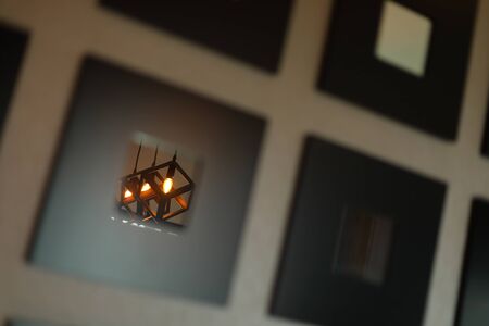 reflection warm light lamp in mirror of interior decoration homeの写真素材