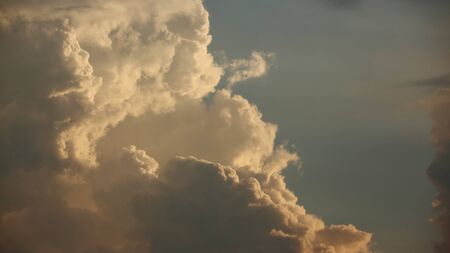 golden cloud on dramatic sunset sky backgroundの写真素材