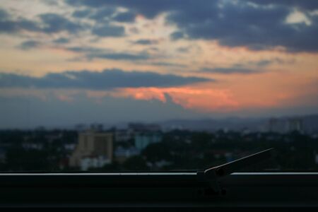 glass window with sunset sky view outside the roomの写真素材